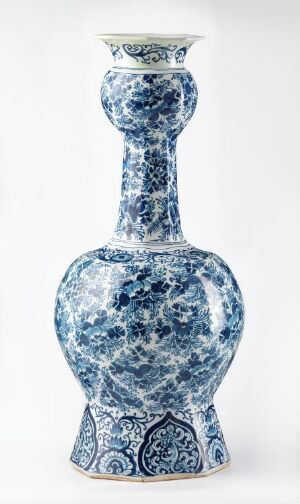  A traditional Chinese-style blue and white porcelain vase with intricate patterns, showcasing a slender neck, bulbous body, and detailed floral and tendril motifs. The artist's name and title are unknown.