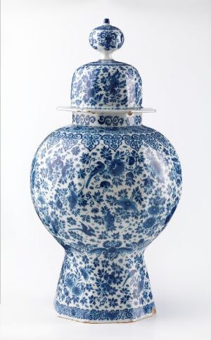  A traditional blue and white porcelain jar with a bulbous base, a fitted lid, and a rounded knob on top, featuring intricate floral patterns in different shades of blue against a white background. Artist name and title are unknown.