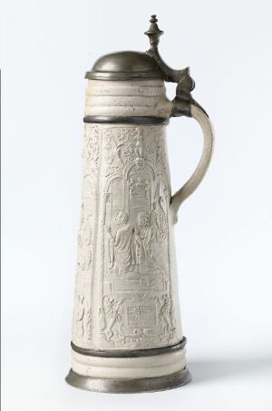  An ornate cylindrical stoneware stein with salt glaze, featuring detailed relief decoration, and complemented by pewter lid, foot, and fittings. The piece is titled "Historien om Tobias" by an unknown artist and is utilized for dining and serving beverages.