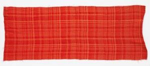  A horizontally elongated red tartan fabric with a grid pattern of lighter and darker red lines forming a checkered design, displayed against a plain white background.