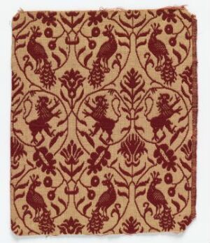  Antique-style fabric with a symmetrical pattern of peacocks and lions in dark red on a warm beige background, displaying a sense of historical elegance and decorative artistry.