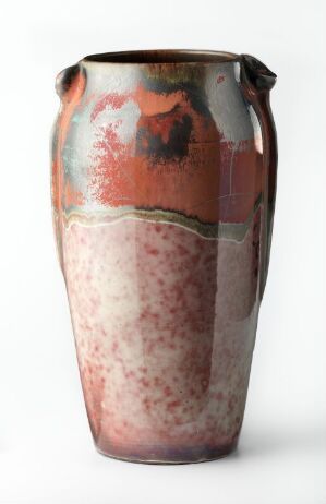  An artisanal ceramic vase with a narrow base and flared rim, displaying a rich color palette with a speckled pinkish-white lower section, a muted green band, and an upper section with fiery orange, crimson, and dark spots. Artist name and title are unknown.