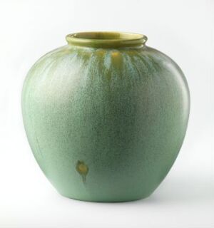  A round, gradient green ceramic vase with a slightly narrowed neck and a smooth opening, exhibiting dark to light green hues with a small blemish on the lower body, against a white background. Artistname and title unknown.