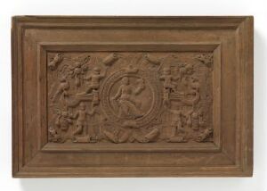  A rectangular wooden bas-relief sculpture featuring a central circular emblem with a figure and intricate surrounding designs, housed within a simple flat-edged frame.