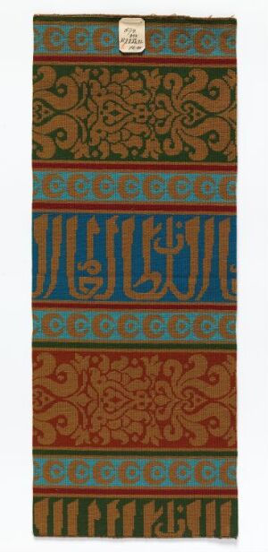  A slender, vertical bookmark with an ornate design. The top and bottom thirds feature intricate brownish-green and rusty red floral motifs. The middle section is dark teal with golden stylized script, bordered by a thin solid line and a small, solid tab at the top.