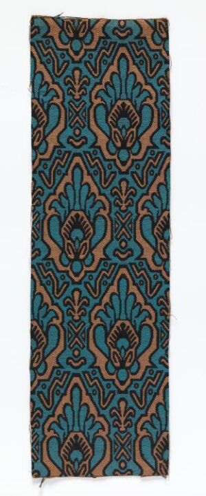  A vertical rectangular textile with an elaborate symmetrical pattern in turquoise, black, and beige on a muted salmon pink background, depicting stylized floral motifs and paisley shapes.