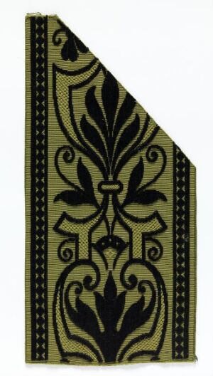  A diagonal cut of fabric with an ornate, symmetrical golden pattern on a black background, framed by a dotted border along the edges.