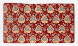  A rectangular textile, possibly a rug, with a repeating pattern of floral motifs in a rich red background, accented with golden-yellow, pale blue, and white, exuding traditional craftsmanship. Artist name and title are unknown.