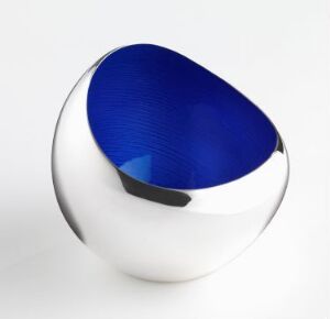  "Loe-bollen," a decorative silver bowl with an asymmetrical opening showcasing a hand-frest, pressed sterling silver exterior with a glossy, textured blue enamel interior, designed by Grete Prytz Kittelsen.