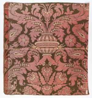  A square-shaped tapestry with a symmetrical floral and ornamental pattern in shades of salmon pink, burgundy, and dark pink.