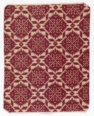  A textile piece featuring a repeated eight-pointed star pattern in a deep red color over a warm cream background, representing traditional geometric craftsmanship.