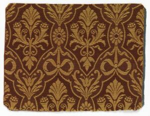  A rectangular piece of fabric or wallpaper featuring a dark brown background with a repetitive, symmetrical pattern in a muted golden color, reminiscent of classical or baroque designs with stylized floral motifs and fleur-de-lis shapes.