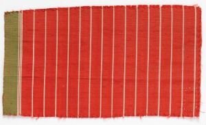  A worn textile sample with vertical stripes in alternating shades of red, green, and yellow, showing signs of age and use with frayed edges.