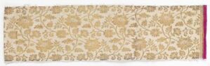  A panoramic image showing an ornate textile strip with a golden tan and beige repeating floral pattern, framed by thin decorative borders, and featuring a striking deep pink or magenta band on one end. Artist name and title are unknown.