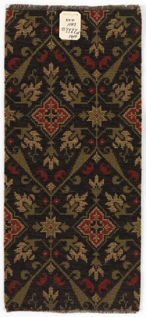  A detailed, patterned textile with a dark brown background showcasing a repeating pattern of diamond shapes outlined in lighter brown, filled with symmetrical floral-inspired designs in shades of olive green, burgundy red, and mustard yellow, giving off a sense of antiquity and elegance.