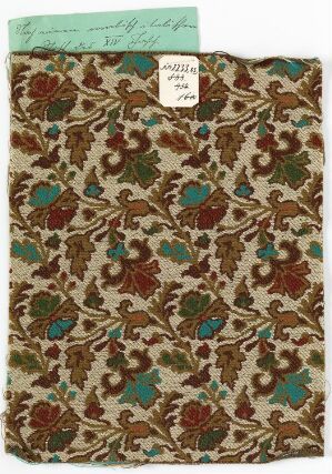  A piece of fabric with an ornate pattern of teal and brown foliage with burgundy floral accents on an off-white background, displaying a traditional aesthetic, with a paper label attached to the folded upper corner. Artist name and title are unknown.