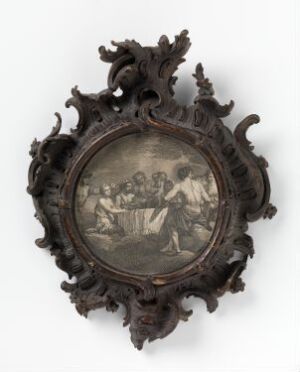  A vintage circular grayscale picture encased in a dark brown ornate baroque-style wooden frame with asymmetrical organic decorations.