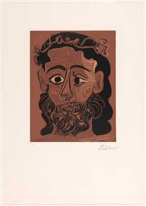  Fine art linocut by Pablo Picasso titled "Homme barbu couronné de feuilles de vigne," depicting a stylized bearded man's face with almond-shaped eyes, a simple nose, and small mouth, crowned with grape leaves, rendered in earthy brown tones against a warm brown background on paper.