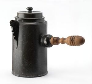  An old-fashioned metal coffee grinder with a weathered dark grey surface and a wooden handle, isolated on a white background.