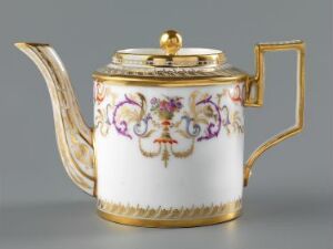  A porcelain teapot with a white gloss finish and decorative floral garland in purple, pink, green, and blue, featuring elegant golden accents on the handle, spout, base, and rim, as well as a gold lid knob.