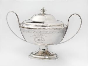  A silver sugar bowl with lid, featuring elegant handles and decorative banding, set against a light gray background.