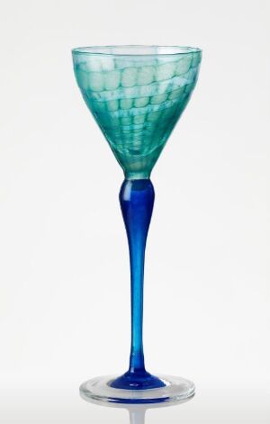  An elegant two-toned wine glass with a textured aqua green bowl and a cobalt blue stem and base against a white background.