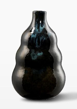  An elegant vase exhibiting a gradient of colors from earthy browns at the base transitioning to opaque black and culminating with a shimmering blue teardrop design at the neck, set against a neutral background.