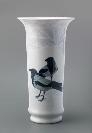  A hand-painted porcelain vase by Porsgrunds Porselænsfabrik AS featuring a lifelike depiction of a bird in shades of blue and grey on a glossy white background, with subtle grey foliage or cloud designs near the flared top.