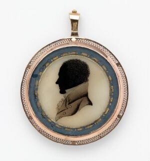  An antique oval pendant with a black silhouette profile facing left, set against a cream background, encased in a rose gold or copper frame with small bead-like details and a loop for hanging.