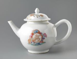  A white porcelain teapot with a floral design and a gold emblem on the side, featuring a curved spout and a large handle, set against a grey background. Artist name and title unknown.