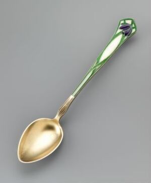  A highly polished golden spoon with an iridescent green handle that tapers to an end adorned with a purple gem-like feature, set against a light gray background. The artist's name and title of the piece are unknown.