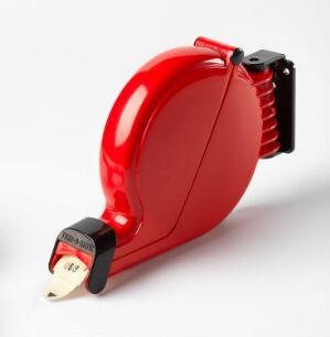  A vibrant red, glossy "D 80 Købillett dispenser" designed by Hans Ehrich, made of molded plastic with metal accents, featuring a sleek, rounded shape with a paper ticket protruding from a black tear-off section against a neutral background.