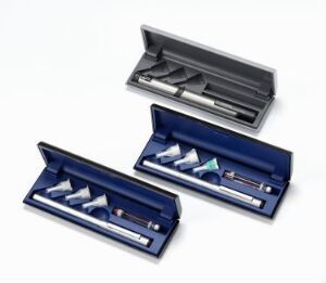  Two NovoPen devices designed by Jørn Rex, each in their open cases; one case in silver and the other in navy blue, showcasing the modern design and simplicity of these medical injection tools.