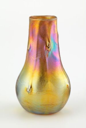  A pear-shaped iridescent vase with a golden yellow base and shimmering hues of blue, purple, teal, orange, and pink reflected on its surface. The vase has a narrow neck and slightly flared lip, and it appears to glow with an inner light.