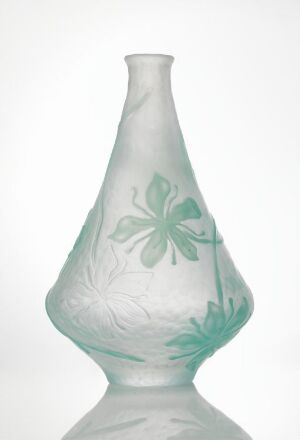  A translucent frosted glass vase with a slender silhouette, decorated with an etched design of a five-petalled flower near the neck and faint leaf patterns around the lower section, set against a white background.