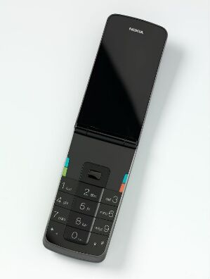  Prototype design for a Nokia phone by Norway Says, featuring a sleek black aluminum body with a top section possibly made from black perspex, and a simple black keypad with white numbers and four small colorful stripes above it.