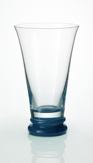  A Kari Ulleberg-designed glass with a clear upper body and a solid blue base, set against a white background.