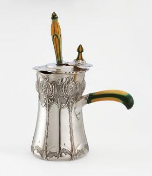  A silver art nouveau chocolate pot with intricate floral embossing, featuring green accents on the handle and lid, and an amber-colored finial on top, displayed against a white background. Artistname and title are unknown.