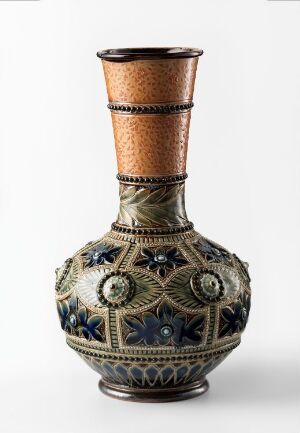  An ornate vase with a bulbous body featuring symmetrical, possibly floral-inspired patterns and a textured cylindrical neck, on a plain white background. The artist name and title are unknown.