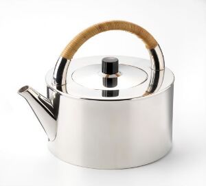  A modern stainless steel teapot with a reflective silver body, a round flat lid with a black knob, and an elegant light tan handle, set against a white background.