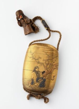  An antique golden-toned metal oval container with a detailed etched scene, topped with a hinged cover, connected by a twisted cord to a small, rustic figurine.