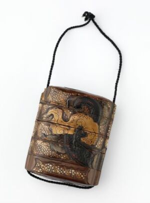  Antique-style pouch with a dark brown body and faded golden artwork on the front, featuring a simple dark cord for carrying. The pouch displays an intricate pattern and has a worn, historical appearance.