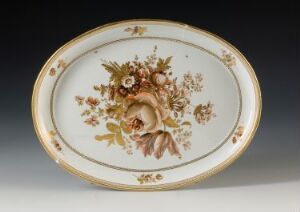  An oval porcelain dish with a hand-painted floral design and gold accents, featuring a large pink rose at the center surrounded by smaller flowers in soft browns, oranges, and greens, set against an off-white background.