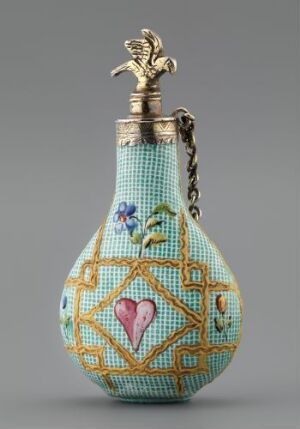  An ornately decorated flask with a textured robin's egg blue surface, featuring geometric patterns, floral motifs, a large pink heart, a silver neck, and a bird-shaped metal stopper connected by a chain.