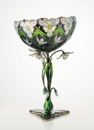  "Sneklokkevasen," a decorative gilded silver vase by Torolf Prytz, featuring colorful enamels in purple and green with white flowers and yellow centers, set against a light background, exhibiting masterful metal and enamel work.