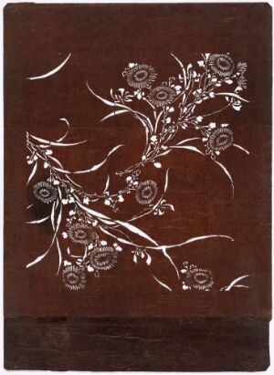  A piece of artwork with a dark brown background and a silver-white floral vine design sprawling diagonally from the bottom left to the upper right, creating a contrast that emphasizes its delicate details. Artist name and title are unknown.