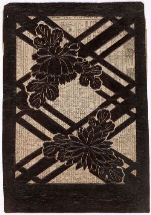  A textured fabric with a natural linen-like color featuring a black diagonal crosshatch lattice pattern and two large, stylized, dark floral elements placed opposite each other.