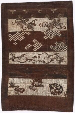  A rectangular, vertically oriented textile with horizontal bands of decorative patterns in various shades of brown, featuring floral motifs, checkerboard designs, and a central lighter band depicting a serpentine figure.