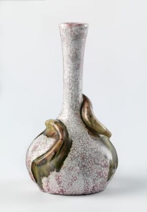  A vase with a white and grey mottled texture and metallic green-bronze leaf-like accents against a light grey background.