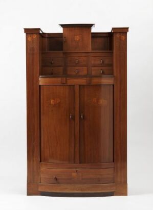  An antique wooden cabinet with a projecting cornice, a central drawer with two round knobs, and double doors below with panel design and central knobs, set against a light gray background.